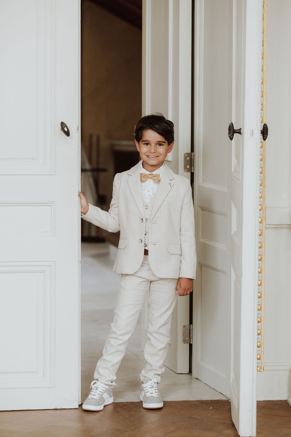 Jongen in communie-outfit uit het HUPSA Lookbook 2026